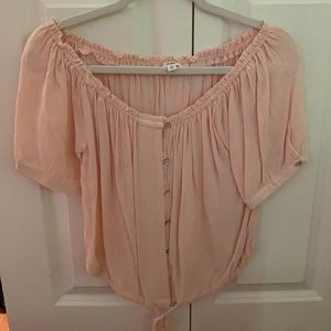 Cute light pink button up blouse.